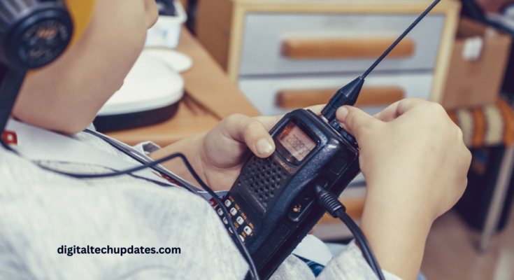 A person cleaning a walkie-talkie with a soft cloth to ensure proper maintenance and long-lasting performance.