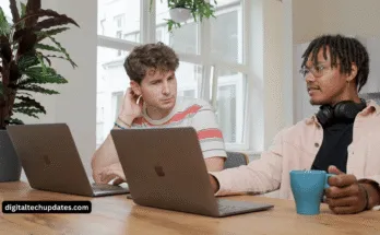 Diverse Startup Founders Discussing Funding Options And Financial Growth Graph